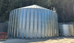 Galvanized steel water storage tank installed at a winery for vineyard irrigation and fire protection systems.